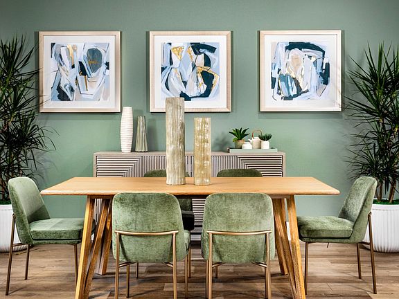 This image showcases the dining space within the Villas Plan 2 model home.