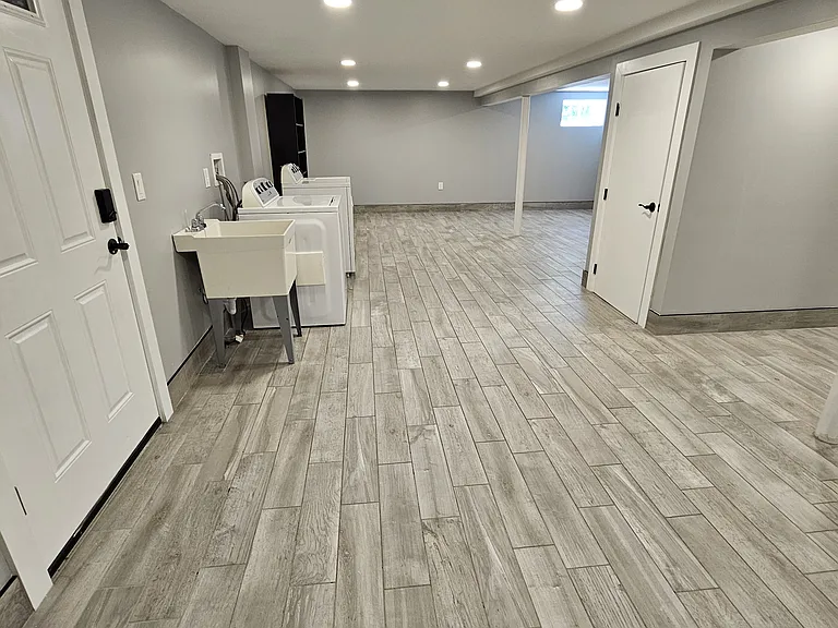 Finished basement; great for storage, for exercise equipment. 
Washer and Dryer with adjacent sink