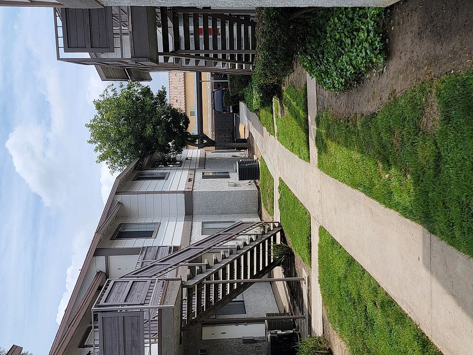 Walkway between buildings at Grand Oaks Apartments in Lake Elsinore, California.
