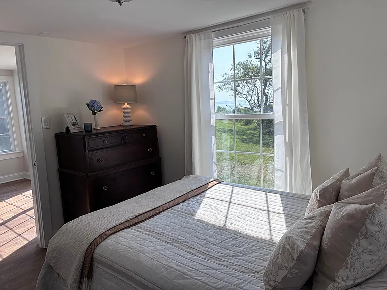 Bedroom #1 has beautiful views of the sunrise over the water