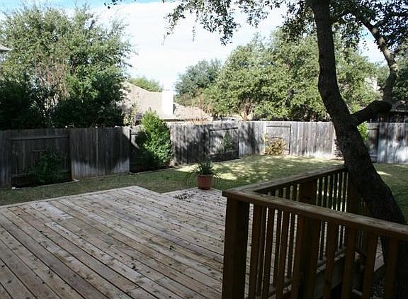 New deck, sprinkler and landscaping in large backyard