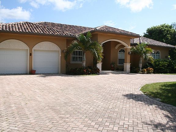 Grand Entrance with Paved Circular Driveway