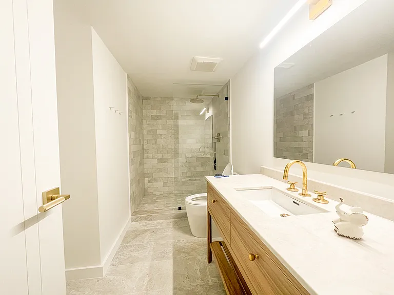Guest bathroom was completely remodeled with high grade finishes and custom cabinetry.