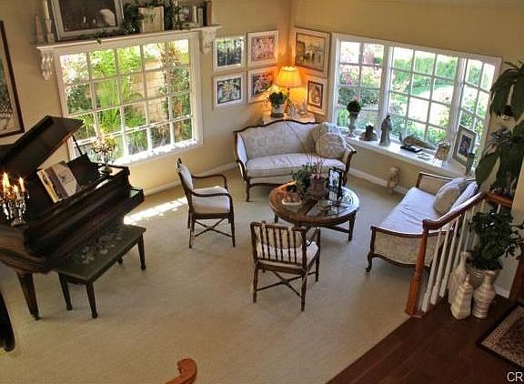 Beautiful replaced windows and woodwork details accent the spaci