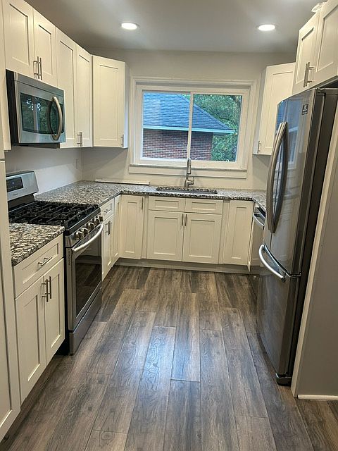 Newly renovated kitchen with granite countertops and SS appliances