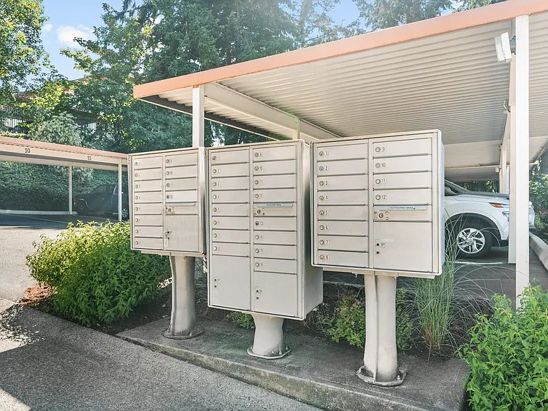 Secure mailboxes with covered access for resident convenience.