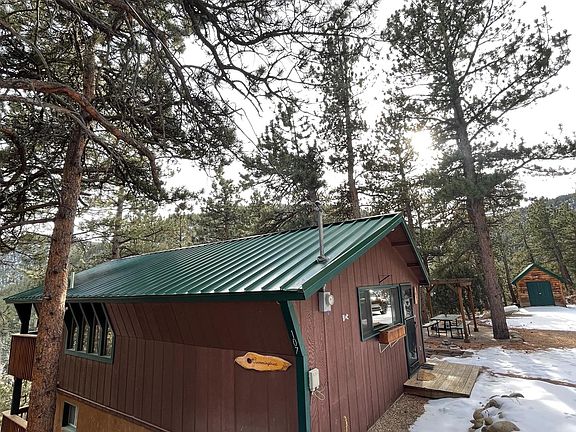 View of house with detached workshop.