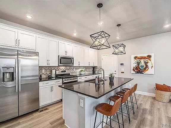 Sizable island. Refrigerator, Gas range and microwave included.