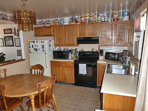 Kitchen Walks Out to Backyard.