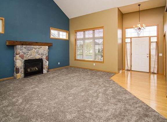 Just inside the front door you will see the Great Room, including gas fireplace surrounded by stone and topped with a wood mantel!
