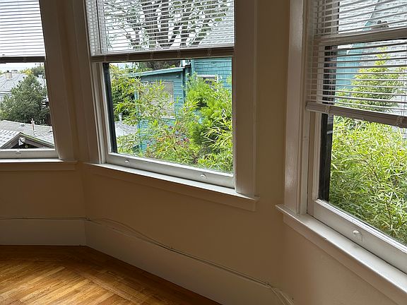 Living room with freshly refinished hardwood floor.