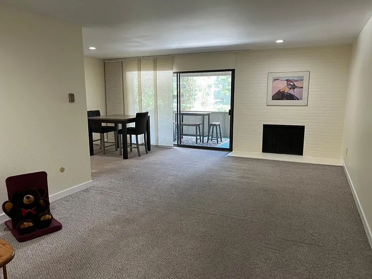 Living room toward dining and patio
