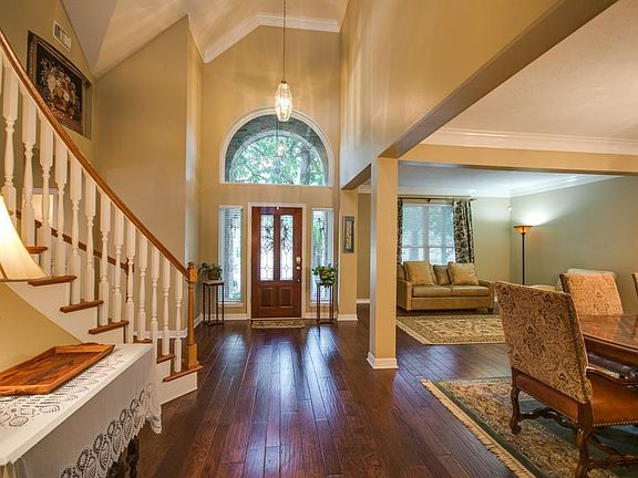 This two story foyer is also open to formal dining and den.
