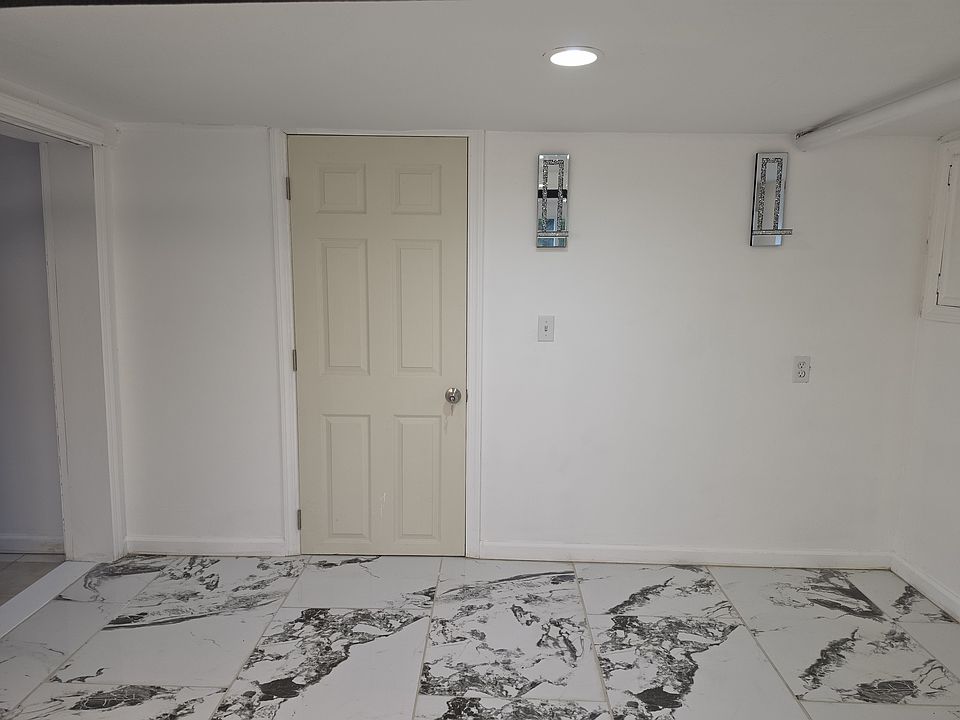 Part of the living area leading to bedroom