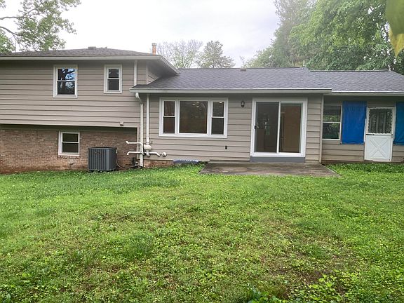 Back of house with small patio.