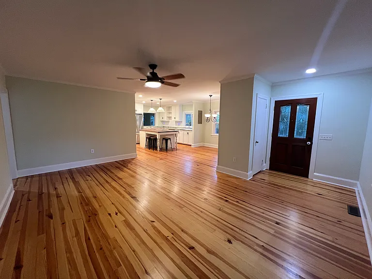 living room looking into the kitchen and dining area