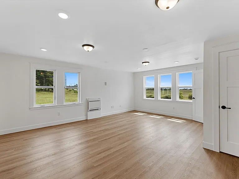 More peaceful views facing NE. All new custom windows keeping the home uniquely quiet.