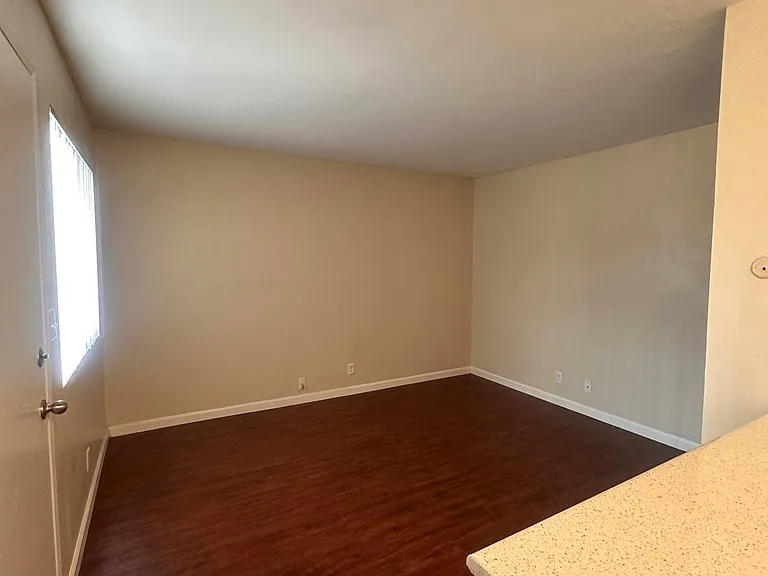 A view of the living room from the kitchen at The Meadowlark Apartments.