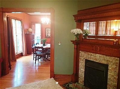 Windows up high provide natural light while still allowing a sense of privacy in the living room.