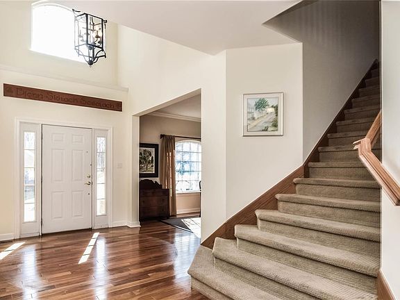 Warm Brazilian wide plank wood floor grace the main level