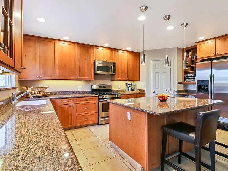 Kitchen includes all modern stainless steel appliances