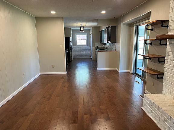 Dining area/hearth room into kitchen area - sunroom to the right