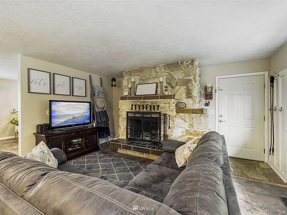 Sit down and relax next to the cozy wood burning fireplace.