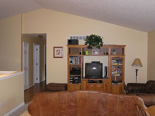 Great room w/ vaulted ceilings, doorwall