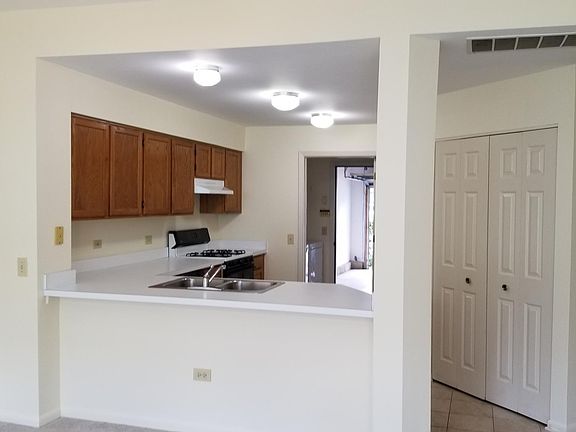 Kitchen from living room with pantry on right