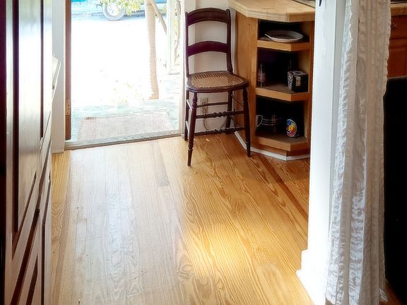 kitchen windows look out on porch...lots of light. more photos can be texted upon request