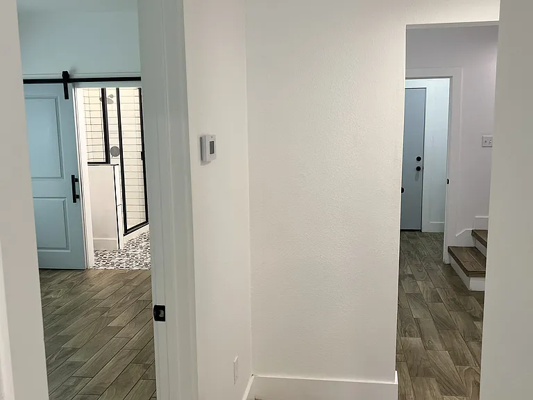 Master bedroom/bathroom (left), hallway (center), bathroom #2 (right)