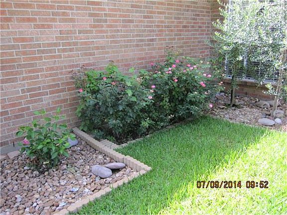 LOW MAINTENANCE RIVER ROCK FLOWER BEDS