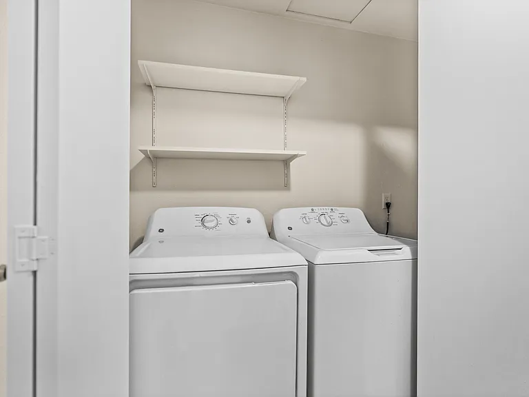 In-home washer and dryer with convenient storage shelving