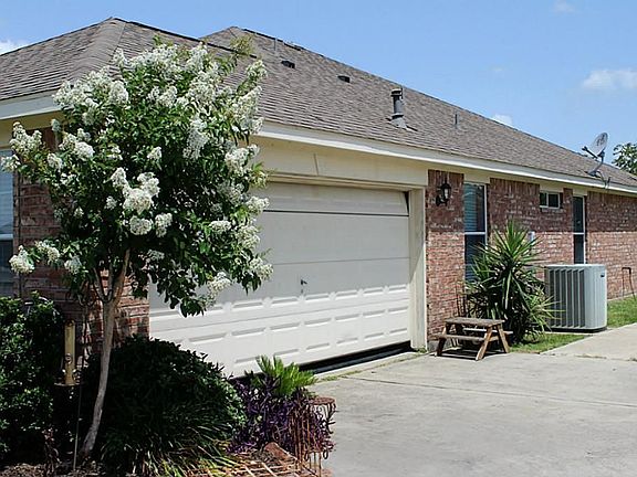 Right side of home has side entry 2 car garage and double wide driveway for extra parking