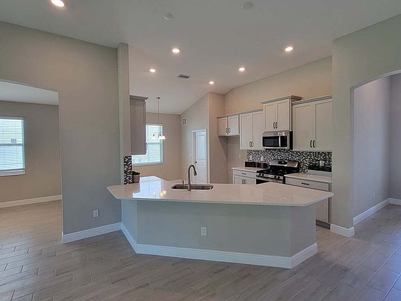 Sweetwater new home plan kitchen at Tea Oliver Terrace at the Fairways by William Ryan Homes Tampa