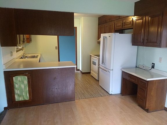 Looking at the kitchen, from the dining room.