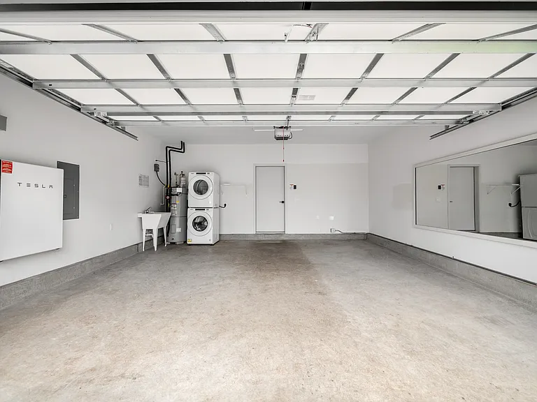 2 car garage. Stacked washer and dryer.
