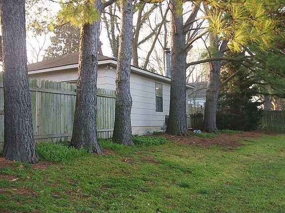 back of garage inside fenced yard