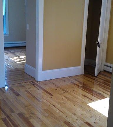View of middle room with 2 closets into small bedroom with one closet. Bathroom is off this middle room.