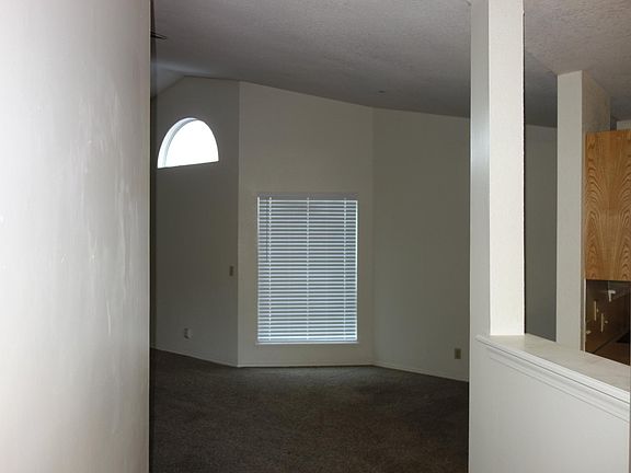 View upon opening the front door. Kitchen to the right and Living room to the left.
