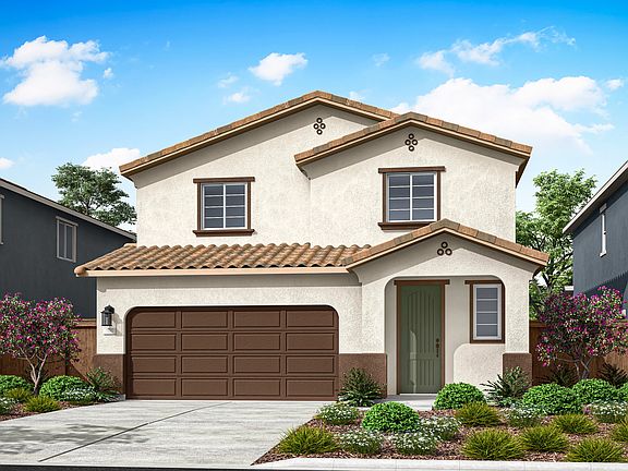 A two-story beige house with a brown tiled roof, a garage door, and a well-landscaped front yard wit