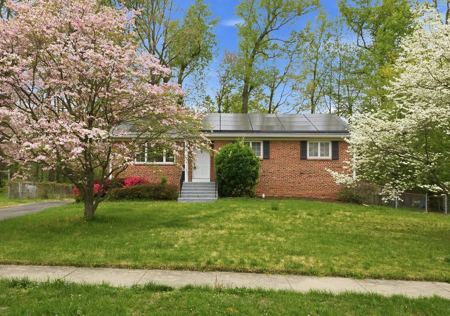 This inviting four bedroom, two bath home with a spacious detached two car garage is located in t... — Photo 1