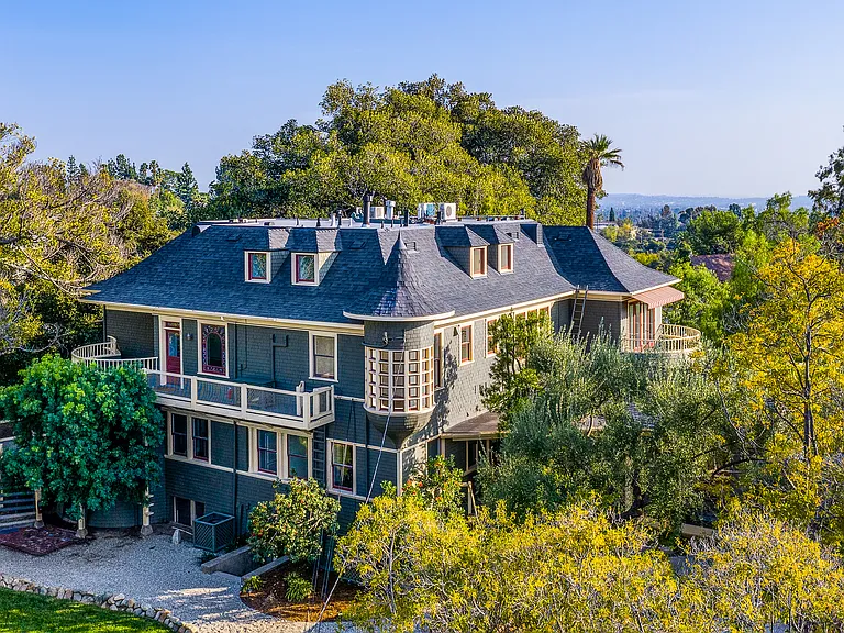 Drone photo of building. Apartment No. 6 is on the second floor with a turret.