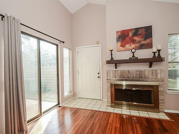 The natural light flows into the entry and family room! A wood-burning fireplace is sure to warm the hearts of all that gather here.