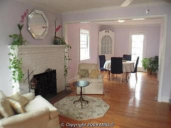 Living room (foreground) and dining or TV room (in background)