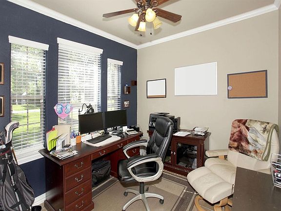 The study is fulled with natural light and over looks the front yard.