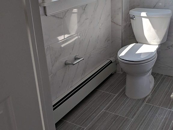 New tile floor and tolet. 