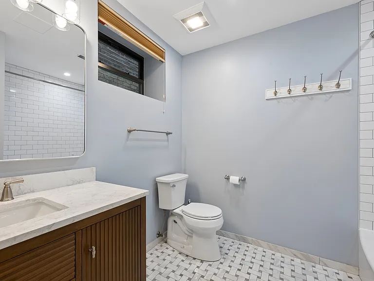 Large second full bath with updated vanity and features throughout.