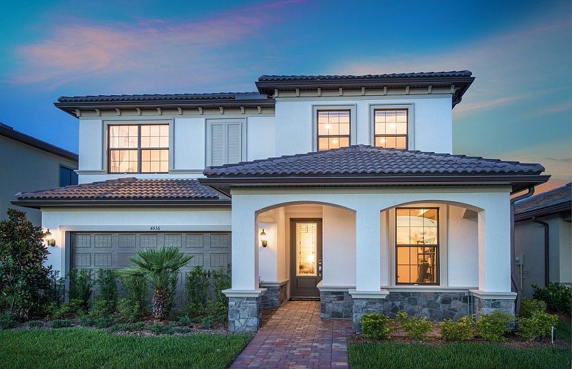 The Fifth Avenue, a two-story family home with a 2 car garage, shown as the model at The Fields Home