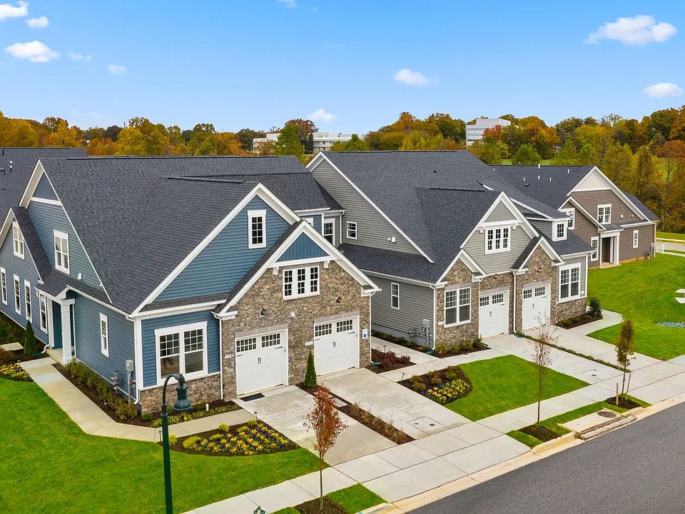 Exterior view of the Blue Ridge, a low-maintenance two-story villa with a main level owner s suite
